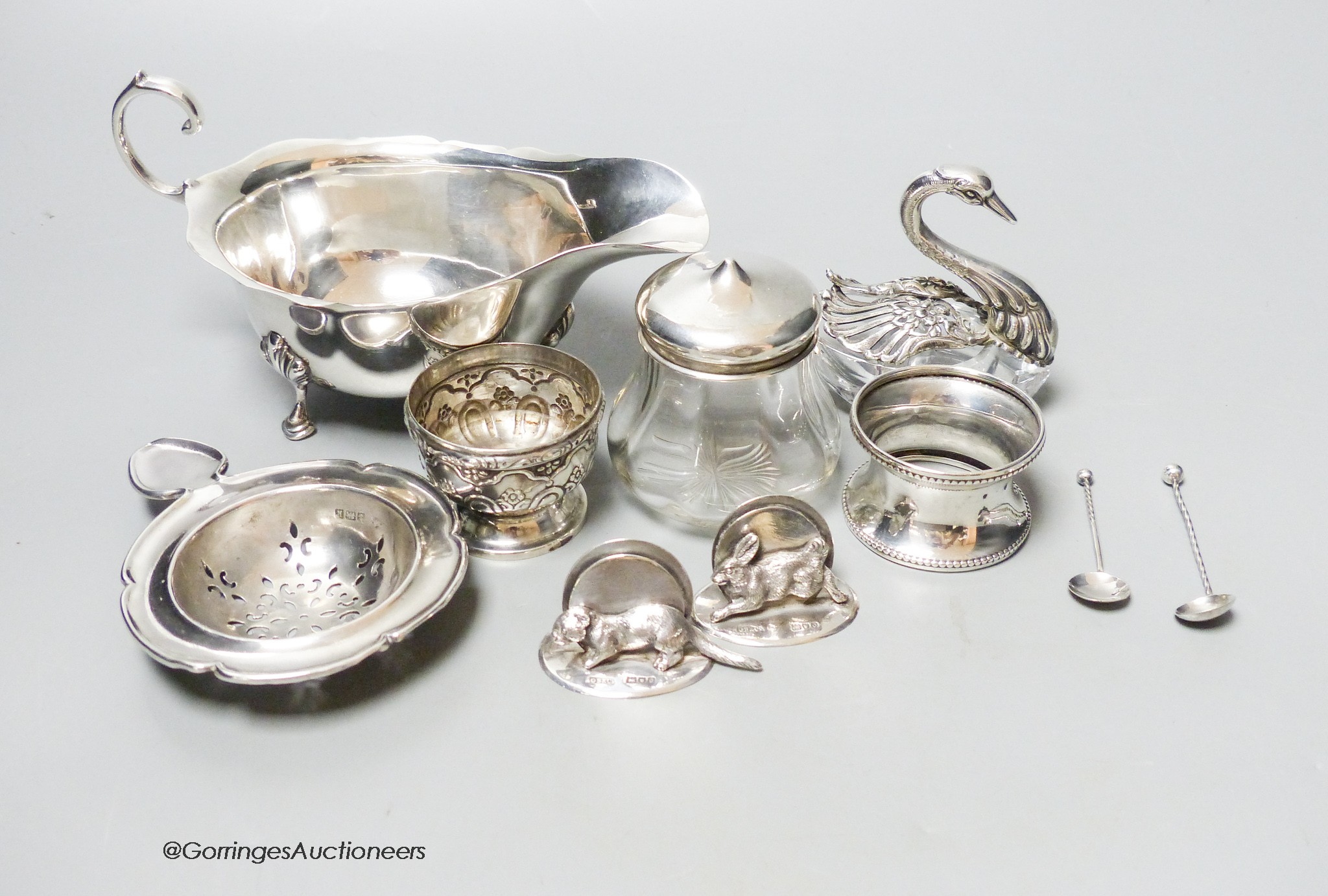 A silver sauceboat, a pair of G. Brace & Co Ltd animal menu holders and sundry silver and silver-mounted items